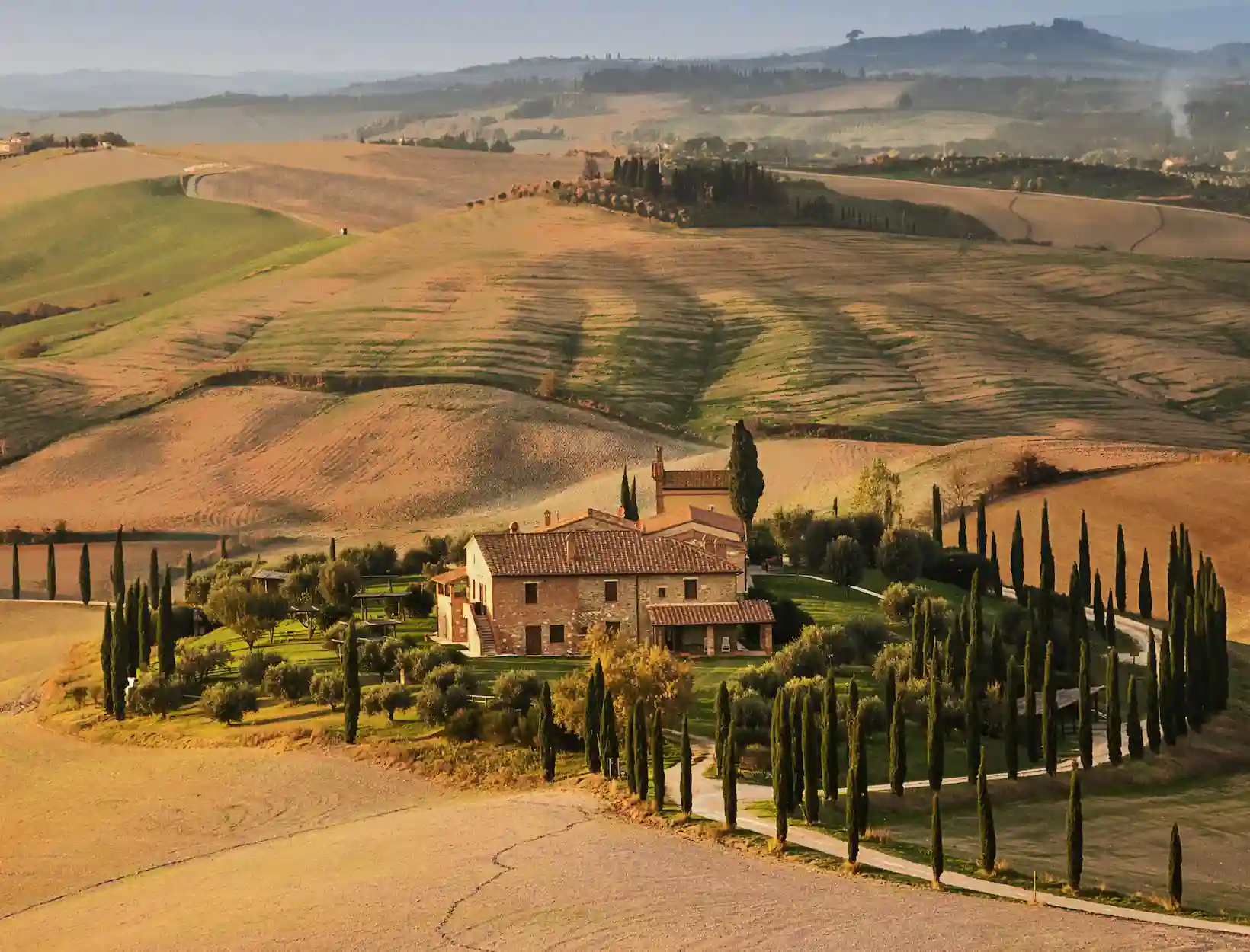 Tuscan countryside with rental vehicles
